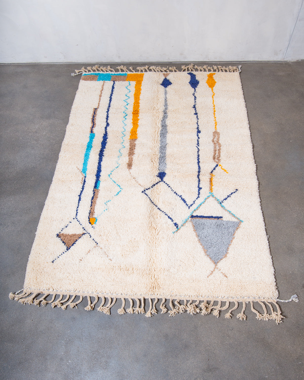Modern, designer, handcrafted Berber rug from Morocco. Beniourain carpet with beautiful colours and patterns and fluffy wool texture.